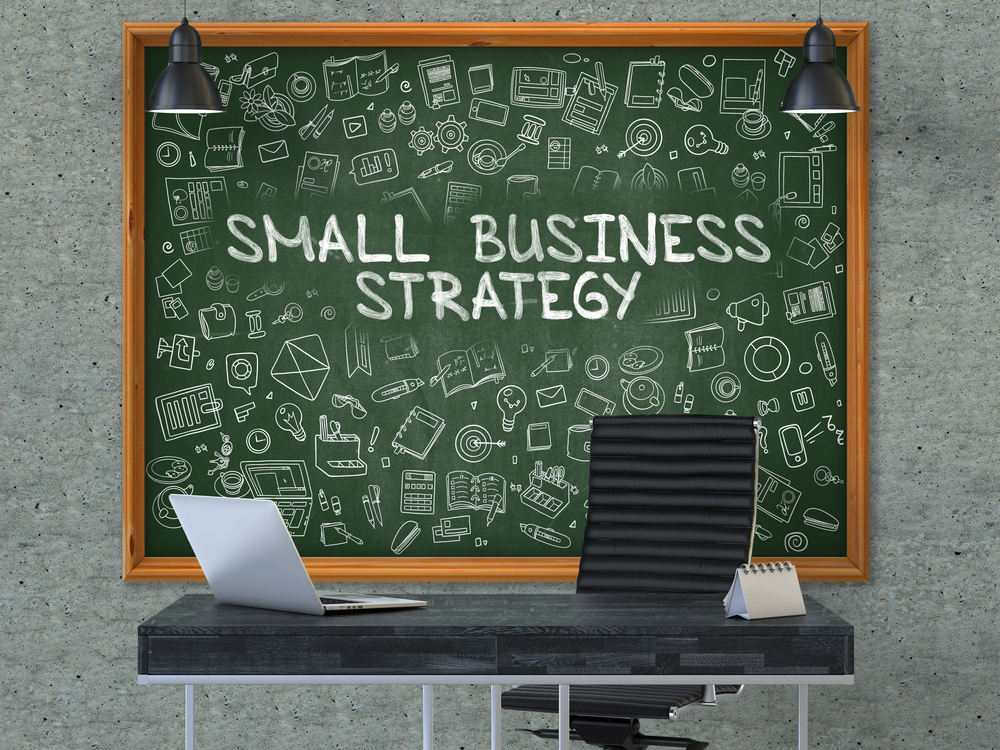 Small Business Strategy. Green Chalkboard on the Gray Concrete Wall in the Interior of a Modern Office with Hand Drawn Small Business Strategy. Business Concept with Doodle Style Elements. 3D.